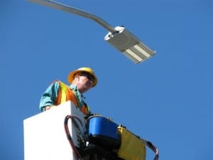 Lineworker Craig Reid tests the first LED streetlight installed in Ballard.