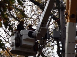 Photo of two Seattle City Light lineworkers helping restore power in Long Island, New York.