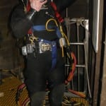 Photo of diver preparing to enter tunnel below Portage Bay.