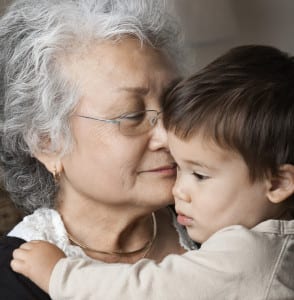 Photo of grandmother hugging her grandson.