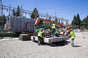 Omega Morgan crew assembles rail system to move the transformer from the trailer to the pad.