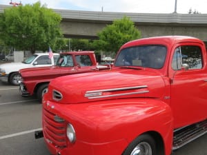Photo of an old, red Ford pickup.