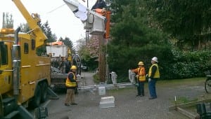 Photo of lineworkers with an automated switch.