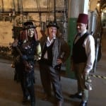 Photo of three people in steam punk costumes.