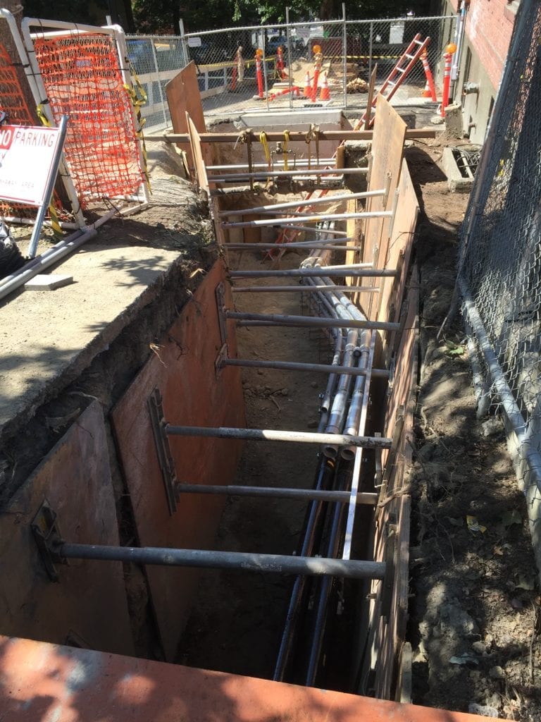 During construction, crews installed new conduit underneath the sidewalk on Minor Avenue.