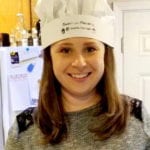 Photo of Elizabeth M. the winner of the Cookin with Kilowatts contest in chefs hat