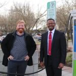 Burien City Councilmember Kevin Schilling and City Light Energy Innovation Resources Officer Emeka Anywanu standing in front of the new electric vehicle charging station in Burien