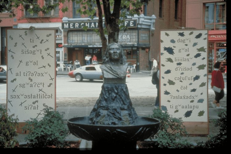 Art sculpture Day/Night located in Pioneer Square next to the bust sculpture of Chief Seattle shows the Lushootseed language.