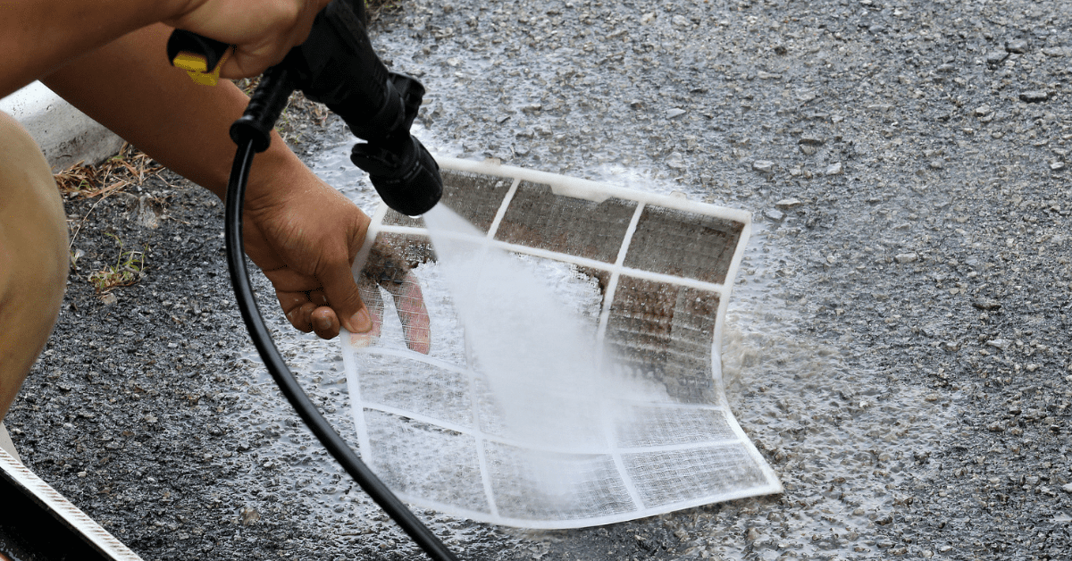 Cleaning reusable air filter with a hose