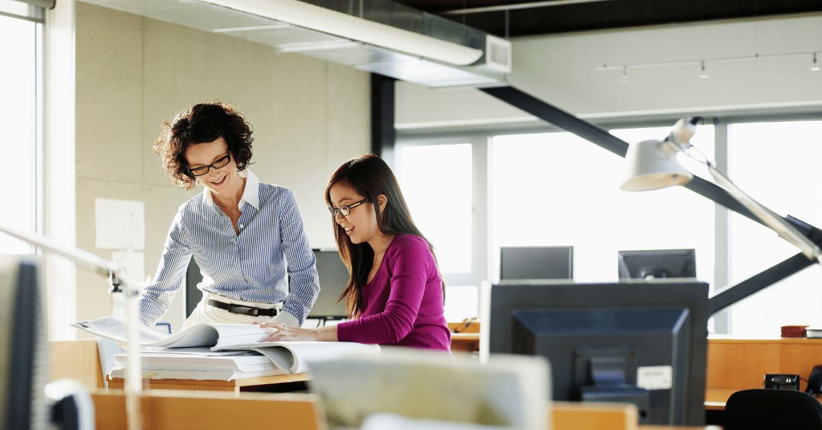 stock photo of office workers looking at documents
