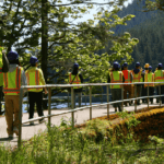 Students walking on the top of cedar falls dam