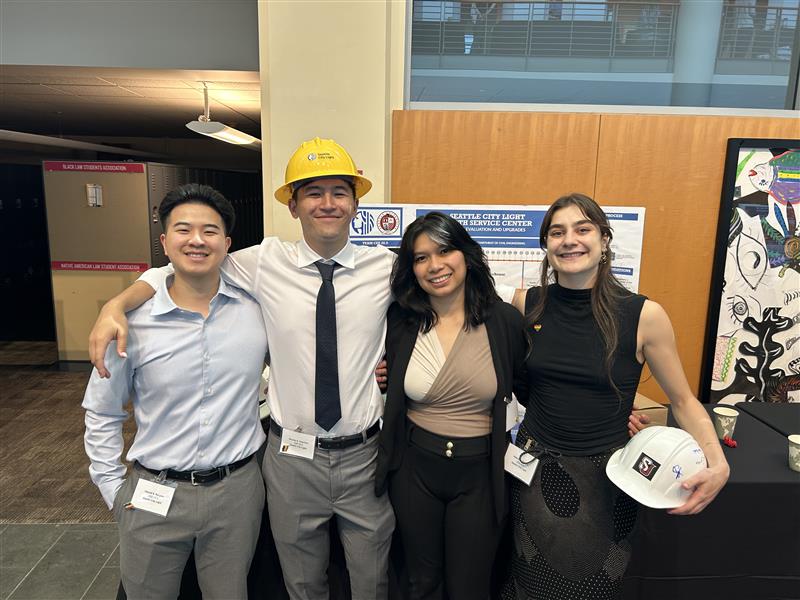 North Service Center team (from left to right) Harold Nguyen, Nic Chantorn, Poala Binuya, and Helene Babalis pose in front of their project poster at SU Project's Day.